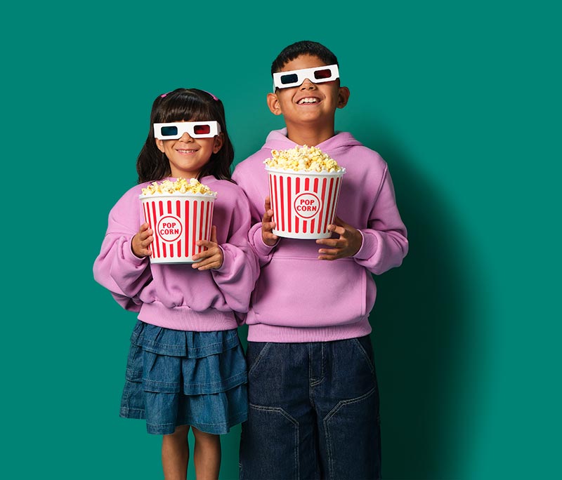 Children holding popcorn buckets