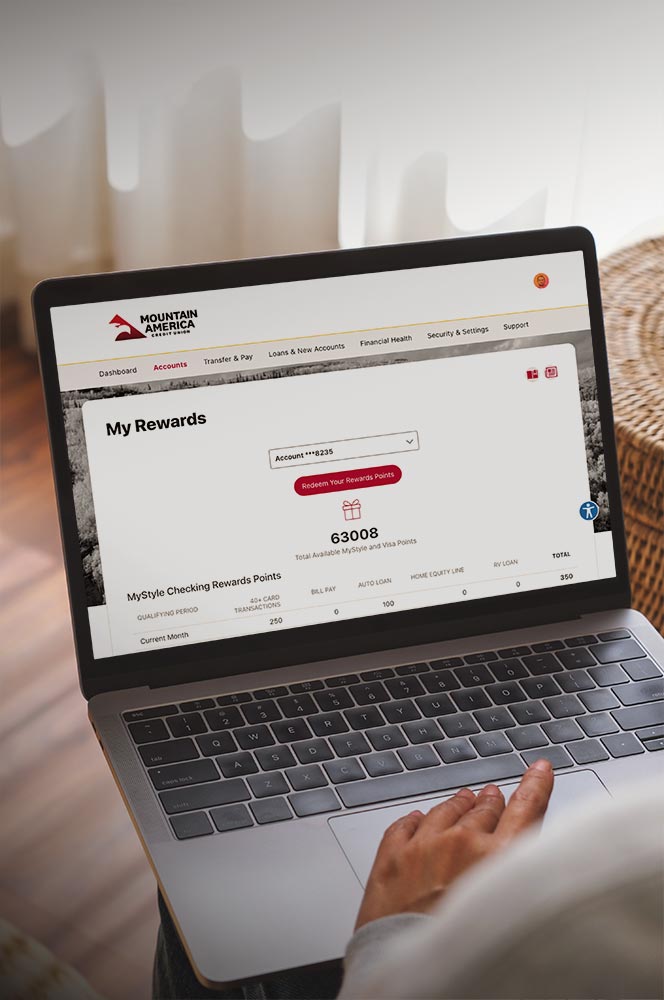 Woman using a laptop to view her rewards