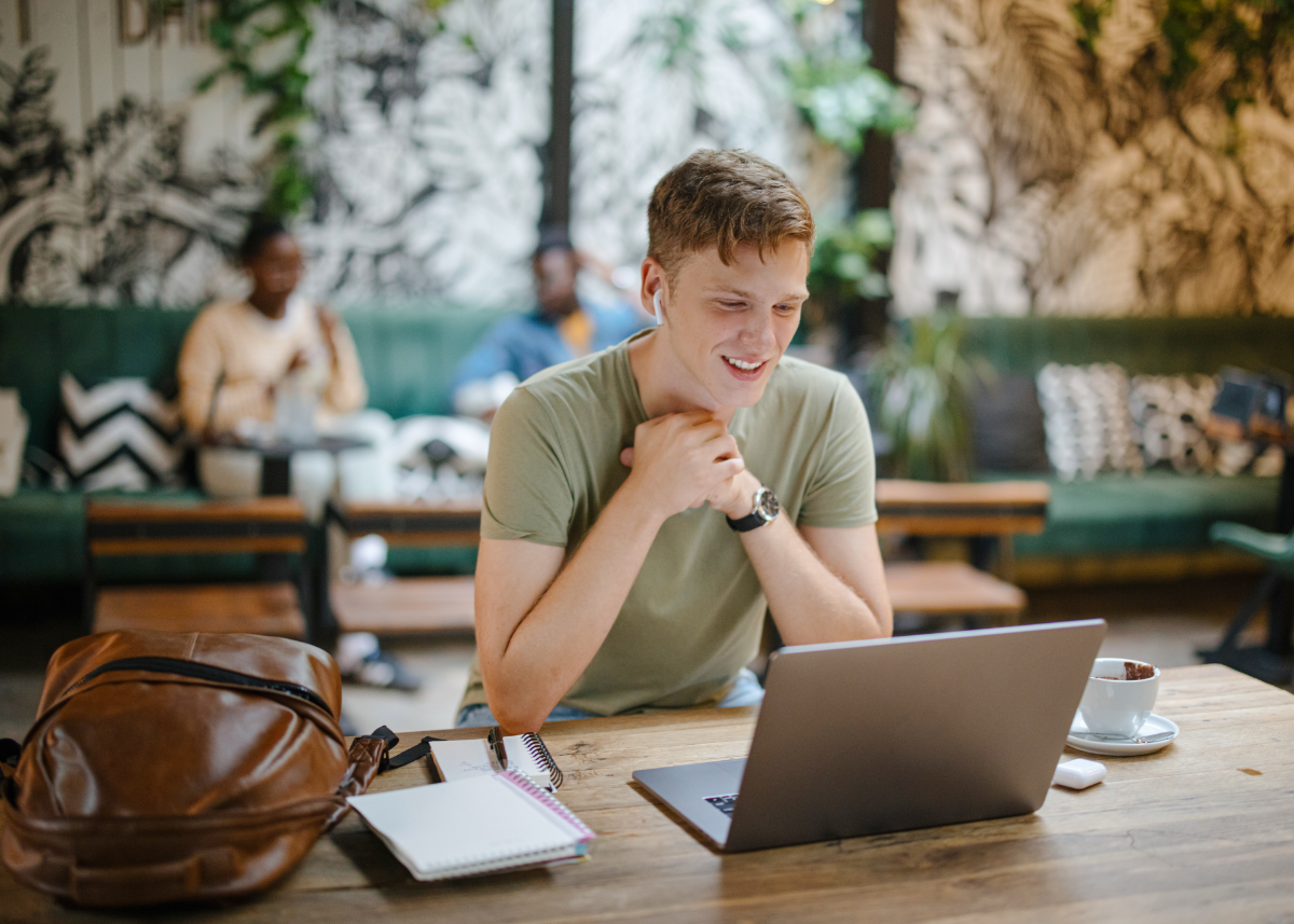 Man on his laptop in a cafe