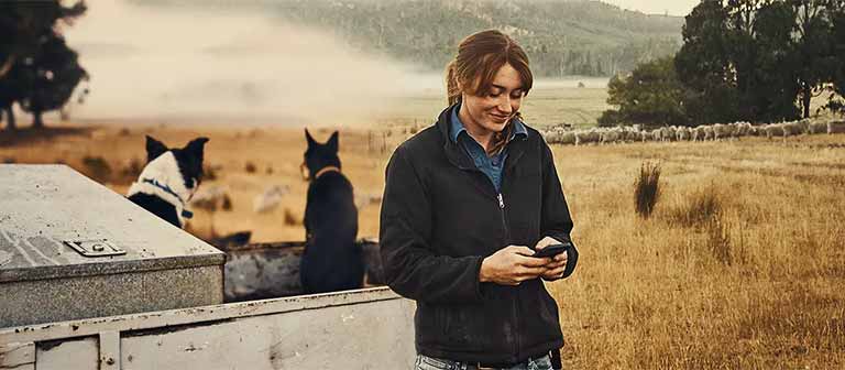 Woman using her phone outdoors