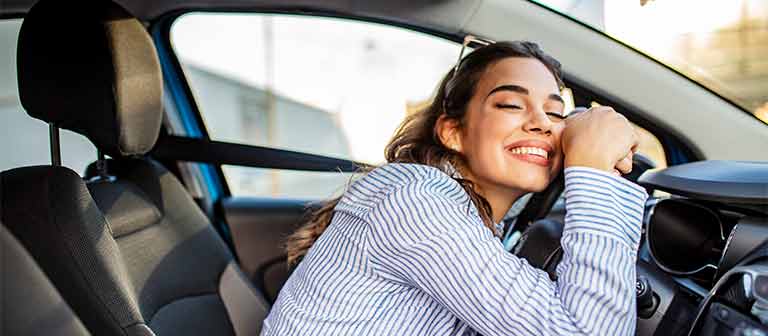 Woman in her car relaxing