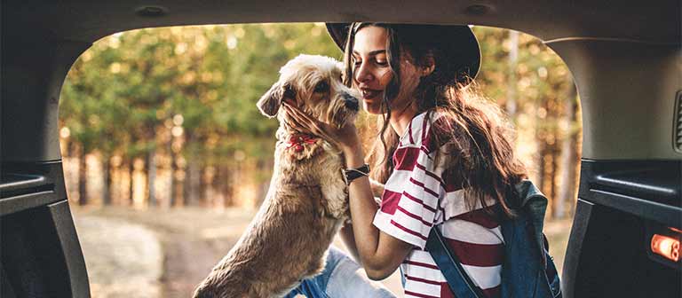 Woman and dog in a car