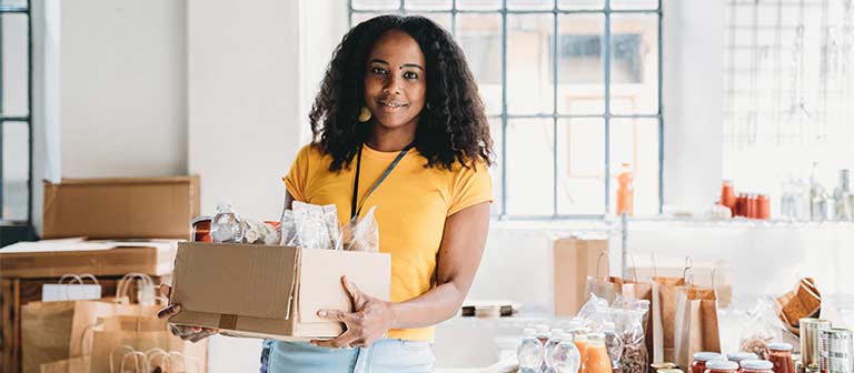 Woman packing boxes