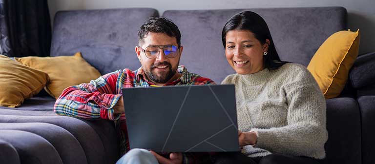 Hispanic couple working on a computer