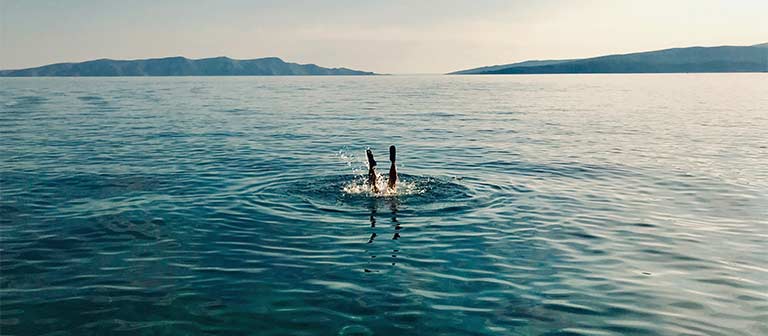 Person diving in the ocean