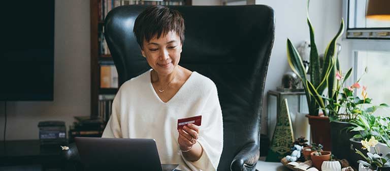 woman shopping online with credit card