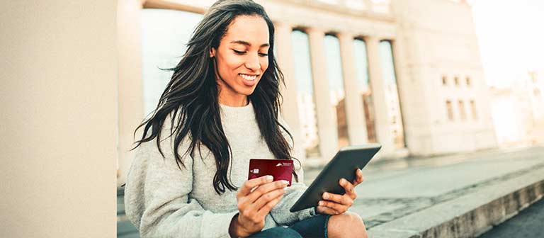 Woman holding debit card