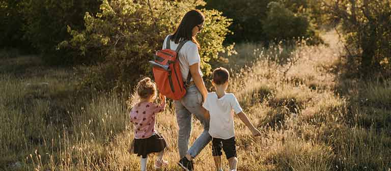 Mom walking with kids outdoors