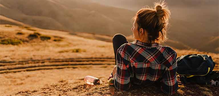 Woman looking pensively into horizon