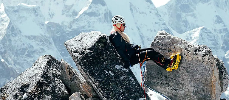 woman climbing in the mountains