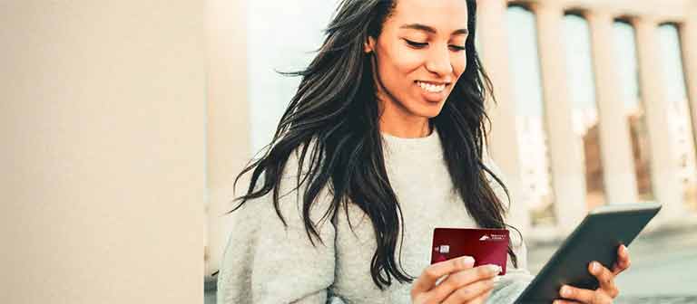 Woman shopping online with credit card