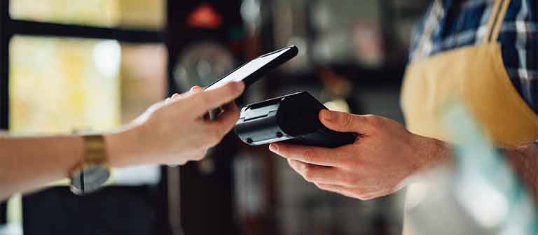 woman paying with a phone