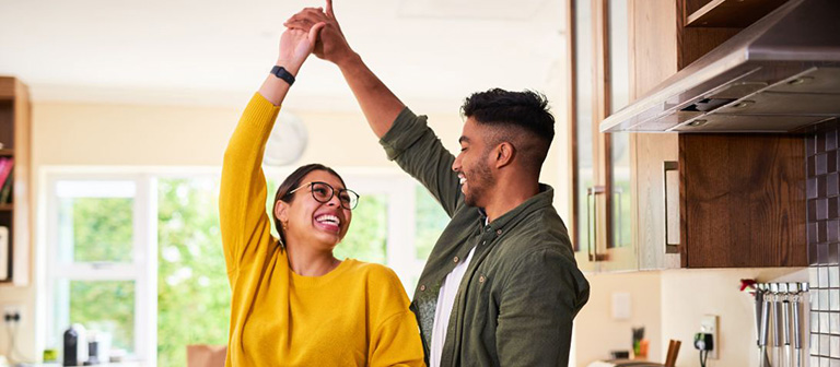 couple dancing in the kitchen