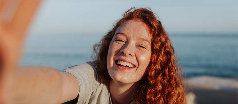 Happy young teen in a boat