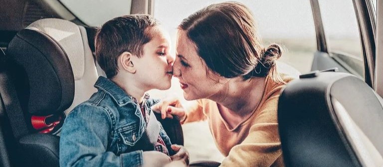 Mother and son in car