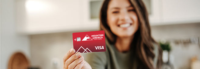 Woman holding a credit card